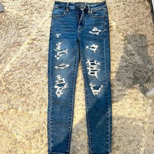 Dark blue jeans rips with patches